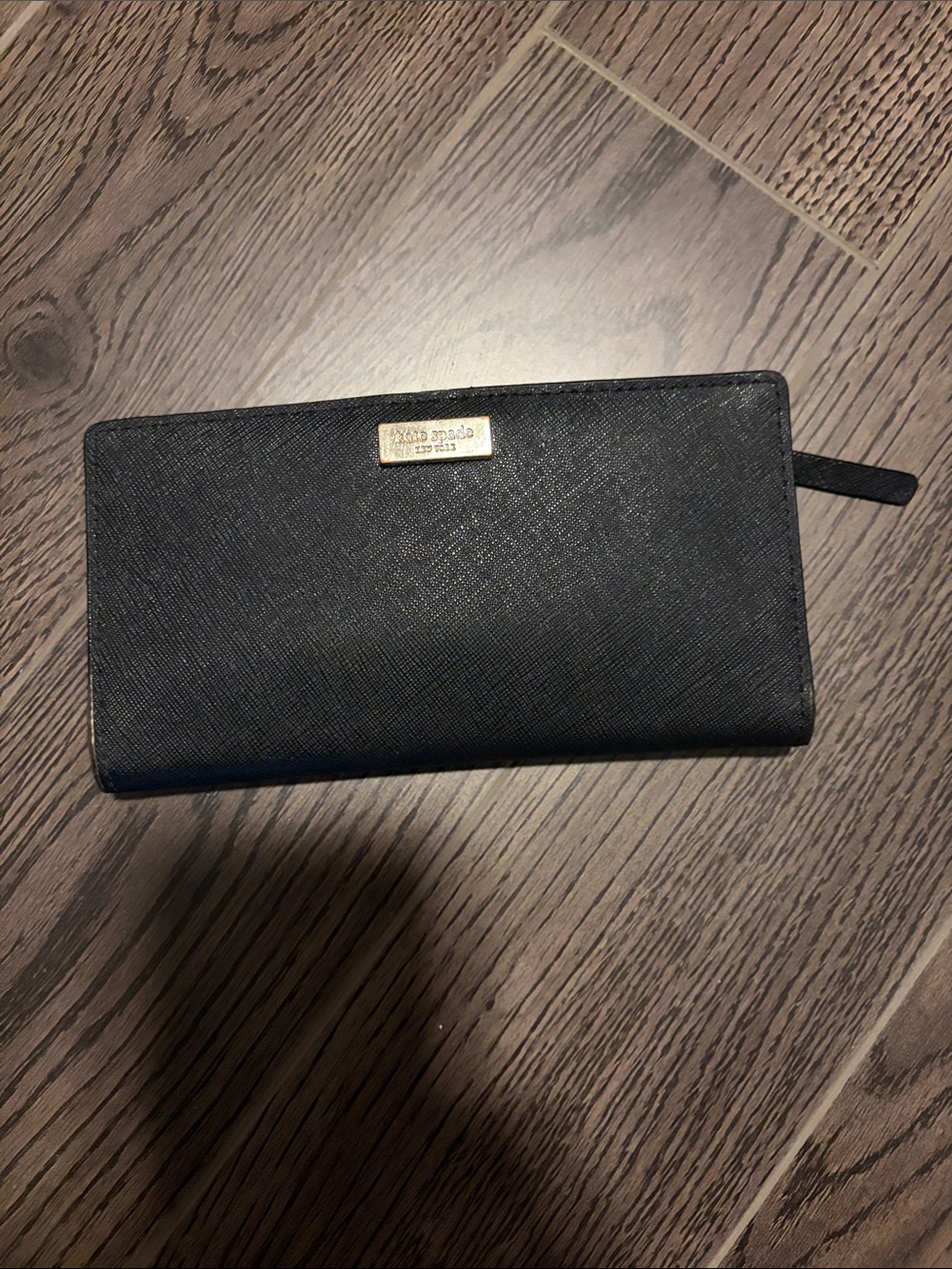 kate spade black saffiano zip-around wallet with gold plaque
